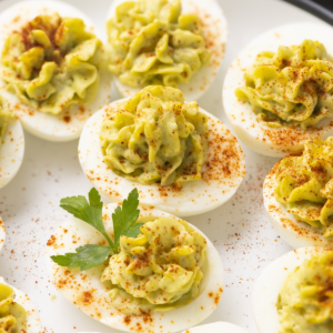 Avocado deviled eggs on a plate, ready to serve.