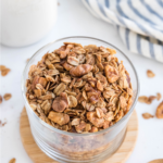 Cinnamon vanilla granola in a cup, ready to serve.
