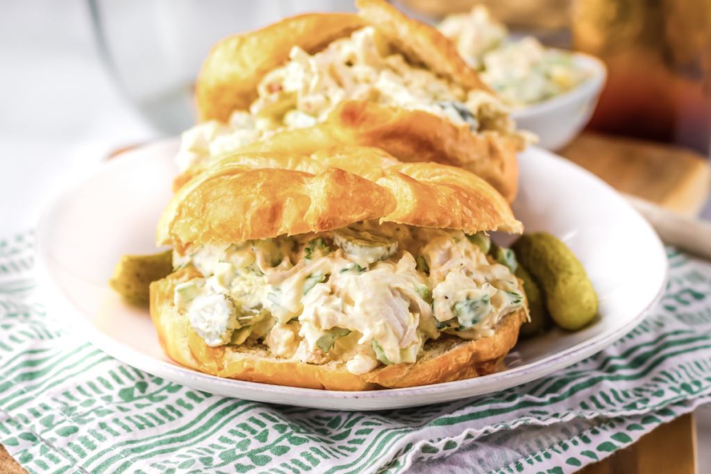 Dill pickle chicken salad on croissonts and ready to eat.