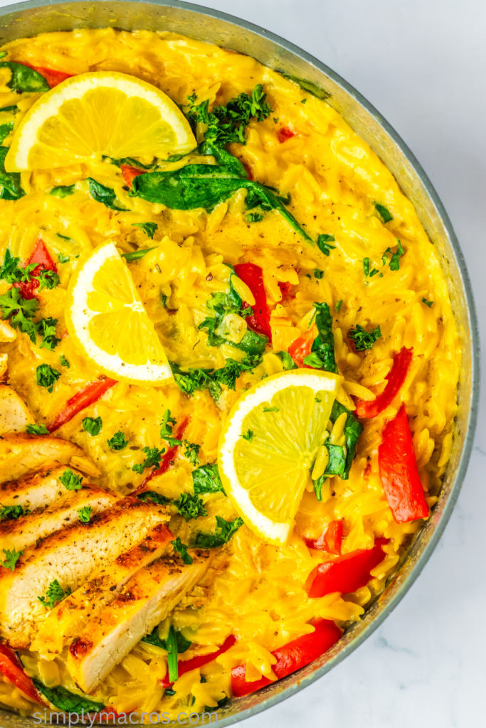 Lemon chicken orzo fully cooked and in a skillet, ready to serve.
