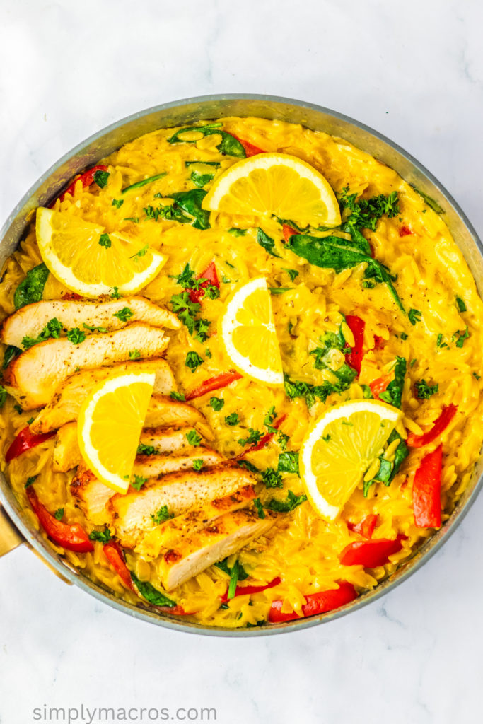 fully cooked lemon chicken orzo in a skillet, ready to serve.