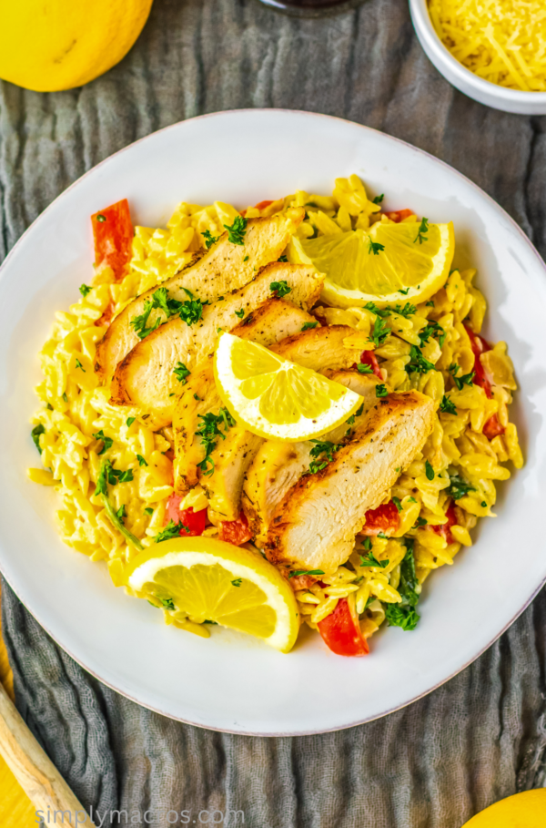 Lemon chicken orzo served on a white plate.