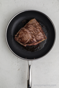 Roast being browned in a skillet.