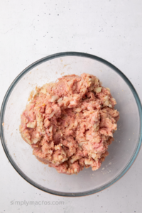 Ingredients needed to make turkey meatloaf combined in a large bowl