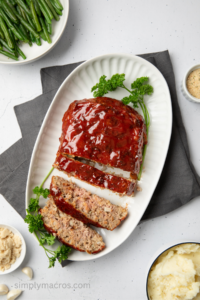 Overhead photo of turkey meatloaf made in the air fryer, on a platter, sliced, and ready to serve.