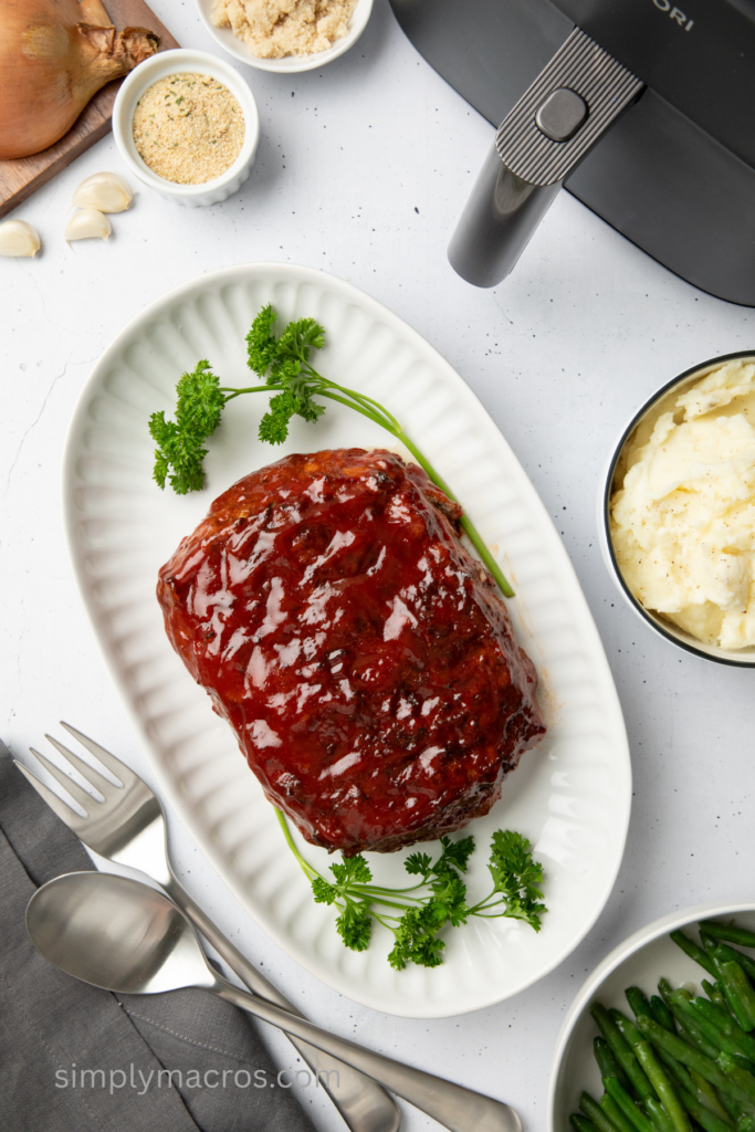 Turkey meatloaf on a serving platter, ready to slice and serve.