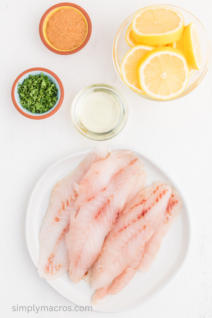 fresh grouper on a plate and ingredients to make blackened pan fried grouper. 