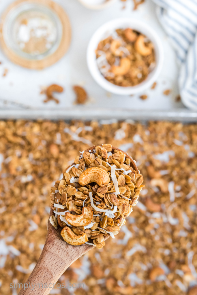 Close up of a spoon with cashew coconut granola. 