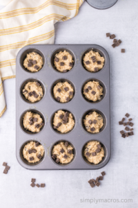 Muffin tin with muffin batter.