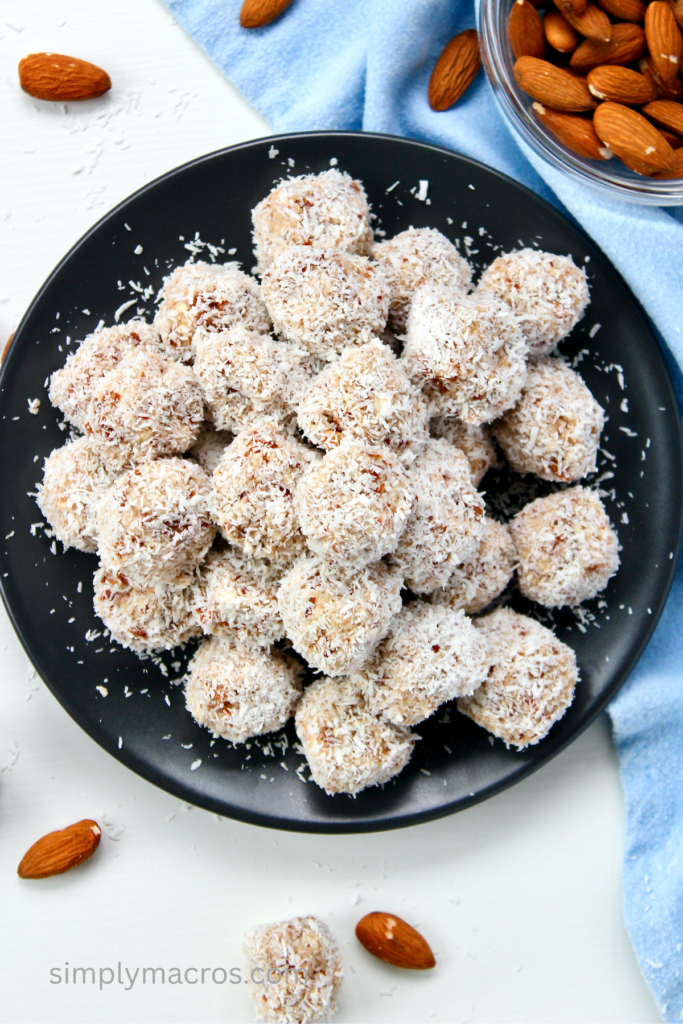 Coconut almond bites on a plate, ready to eat. 