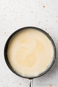 Sauce thickened in a saucepan.
