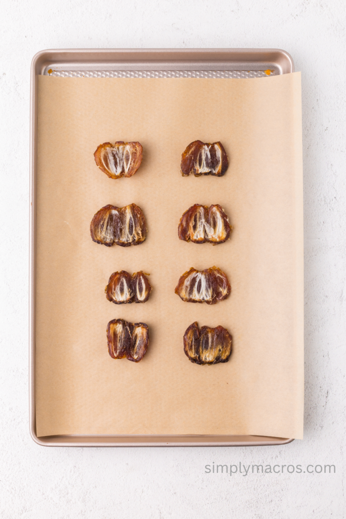 Dates opened and flattened into parchment paper. 