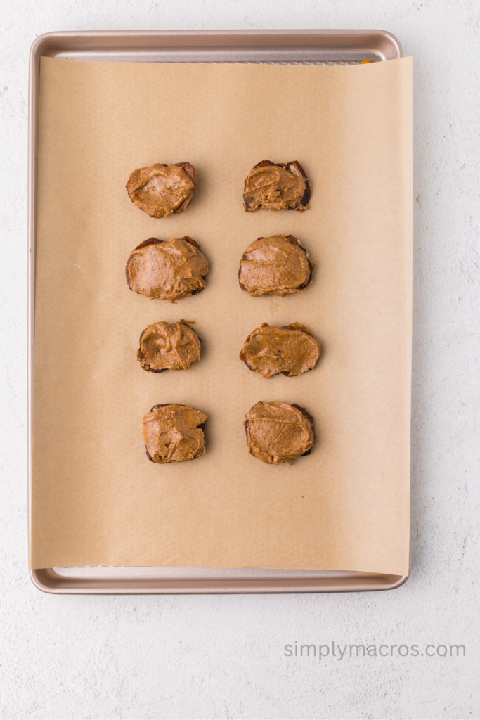 Almond butter added to the flattened dates. 