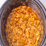 Overhead shot of sweet enchilada pork in the slow cooker.