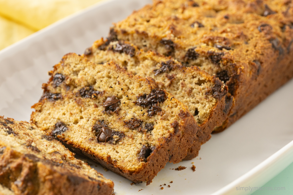 Sliced chocolate chip protein banana bread on a plate and ready to serve.