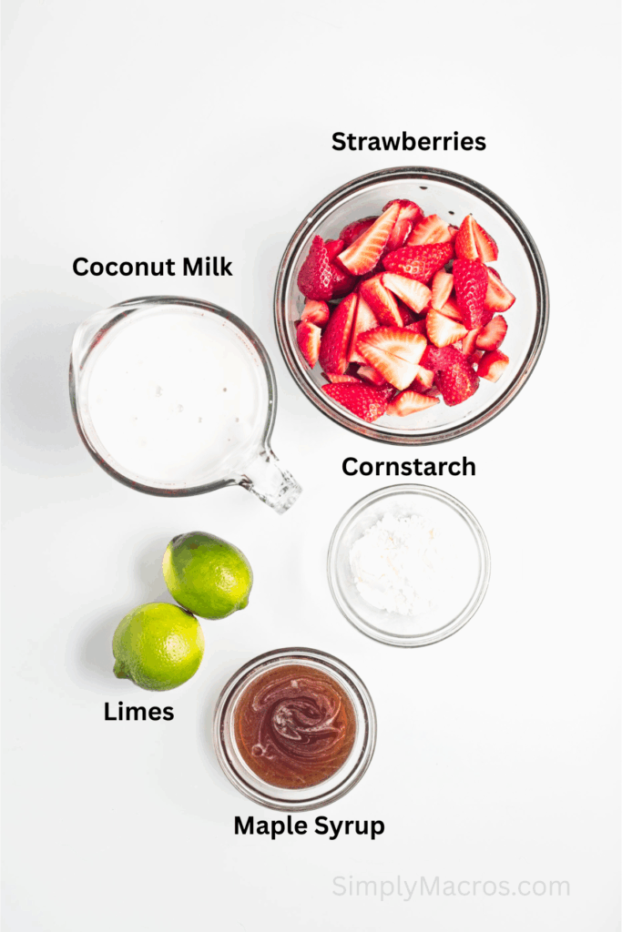 Ingredients to make creamy popsicles with lime and strawberries measured on a table ready to use.