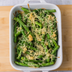 Overhead photo for garlic parmesan green beans in a casserole dish.