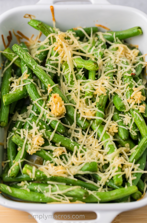 Close up of casserole dish with oven roasted garlic parmesan green beans.