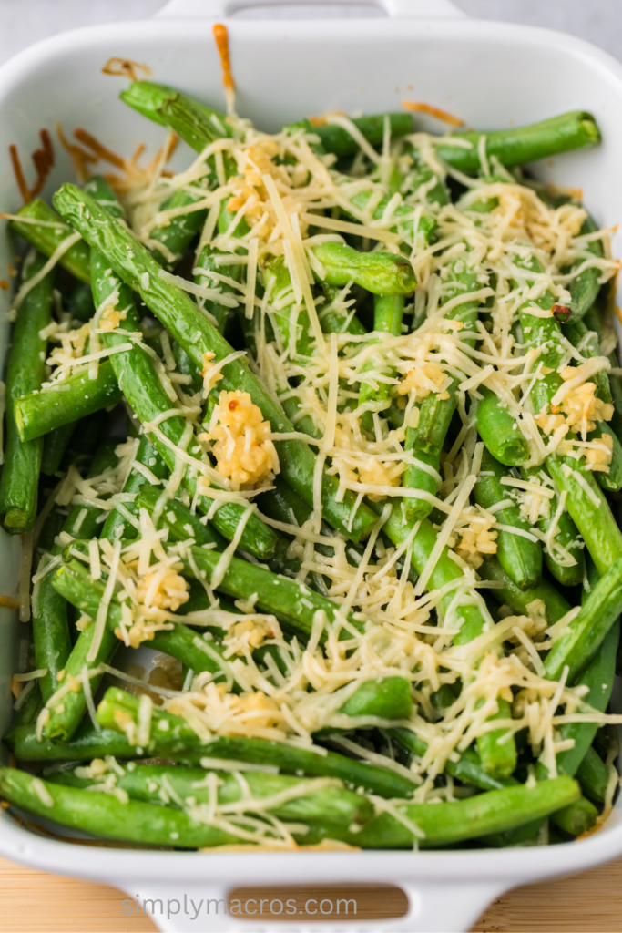 Close up of casserole dish with oven roasted garlic parmesan green beans.