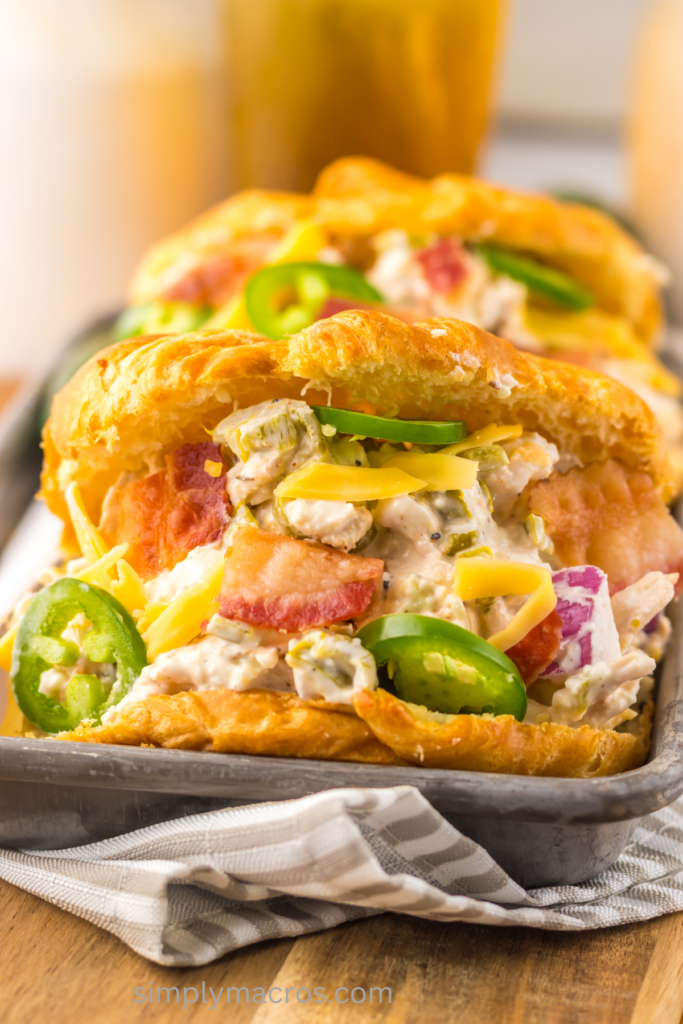 Close up of jalapeno popper chicken salad on croissants, ready to eat.