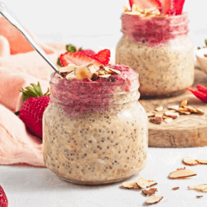 Strawberry almond chia pvernight oats in a jar, ready to serve.