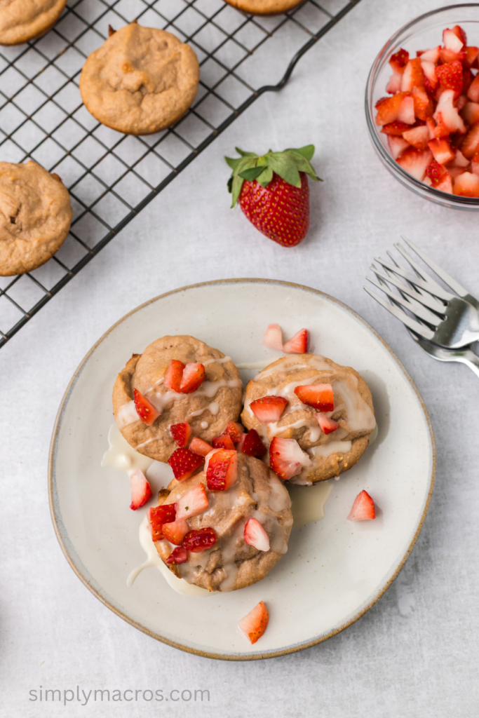 Close up of strawberry cottage cheese muffins on a plate ready to eat.