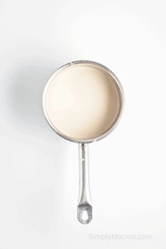 Coconut milk, cornstarch, and maple syrup cooked and thickened in a saucepan.