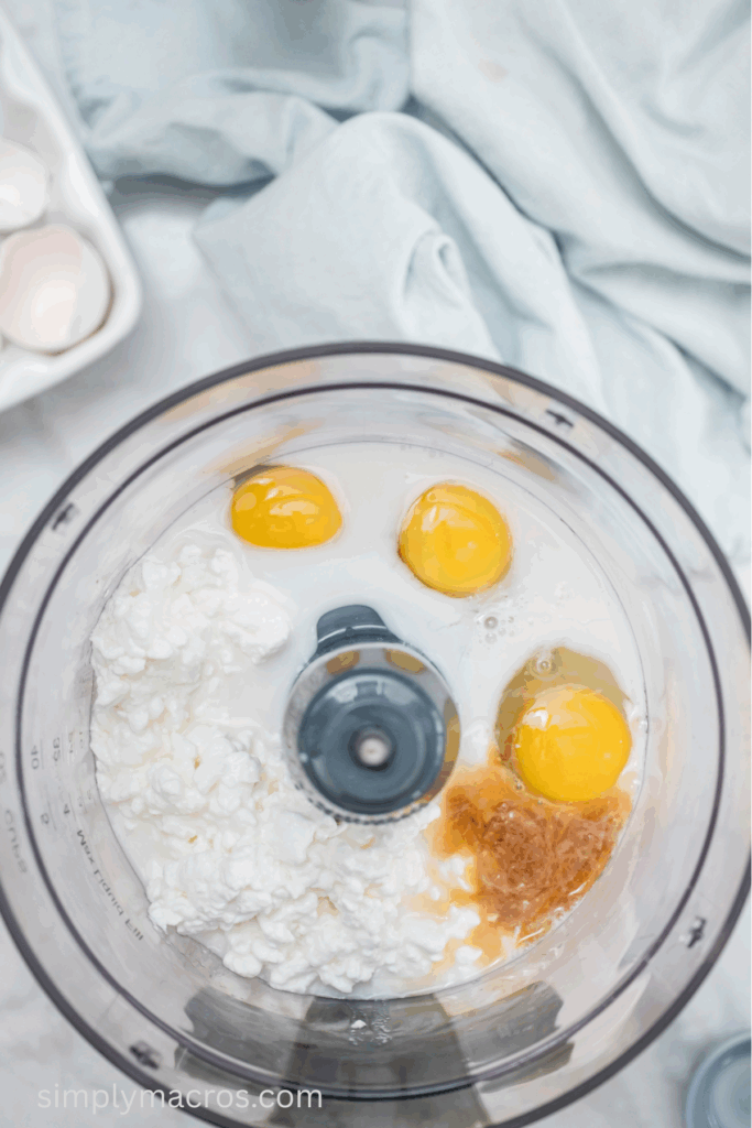 Eggs, vanilla, almond milk, and cottage cheese in a food processor.