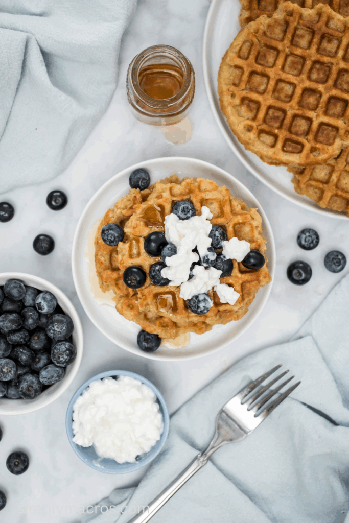 High protein waffles topped with cottage cheese and berries and ready to serve.