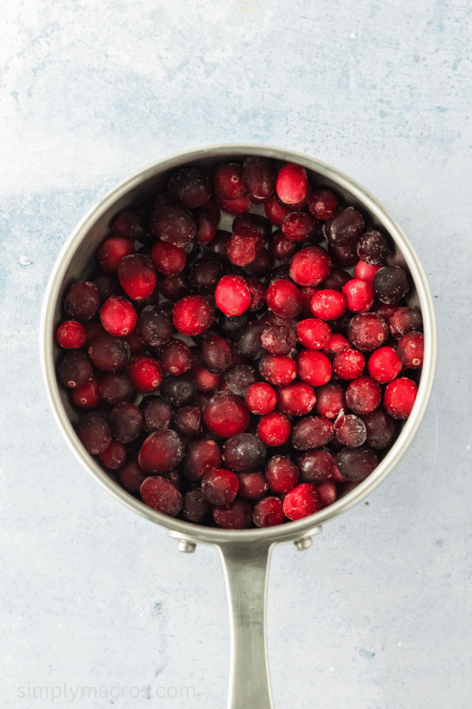 Cranberries added to the saucepan.