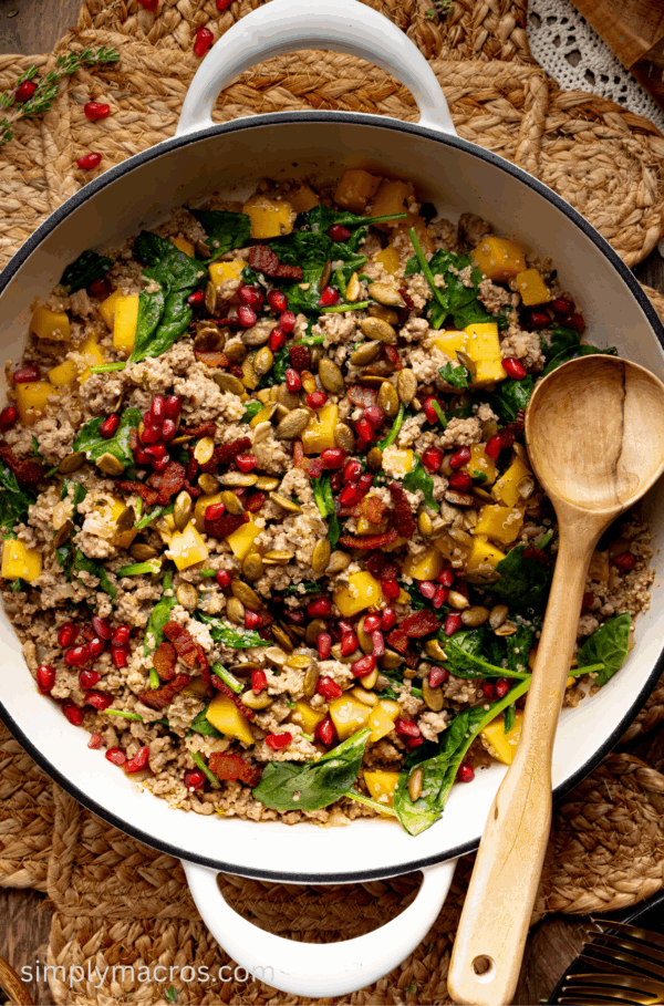 Turkey quinoa skillet with butternut squash topped with pumpkin seeds and pomegranate.
