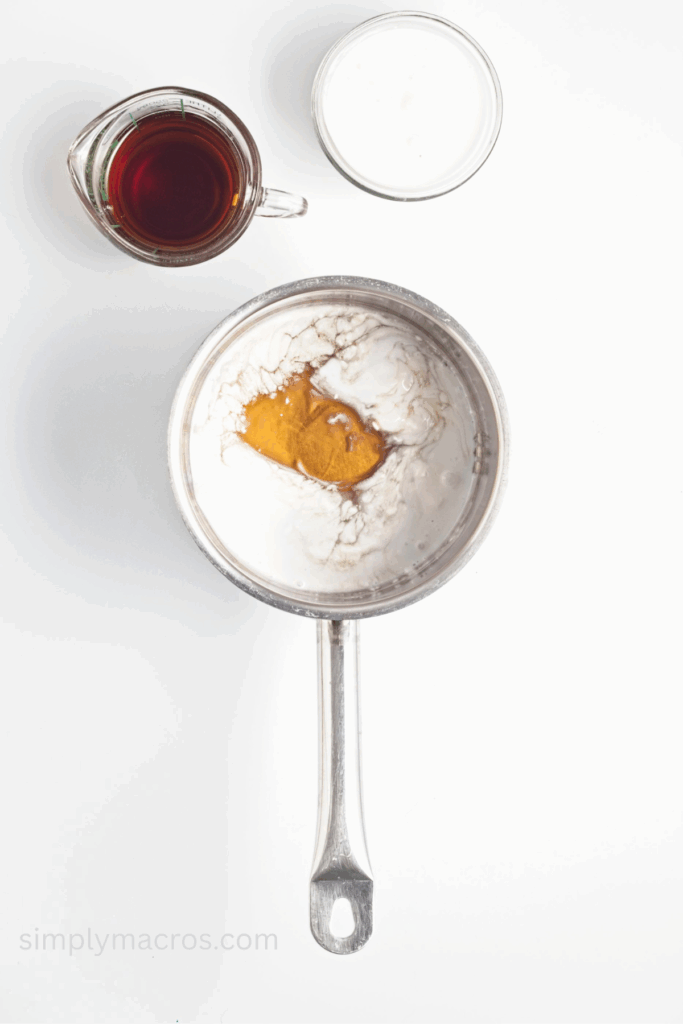 Maple syrup and coconut milk in a saucepan.