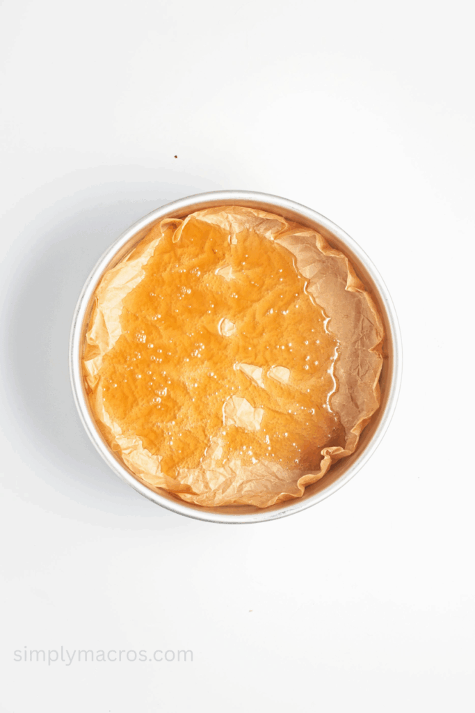 Prepared cake pan coated with coconut milk and maple syrup mixture.