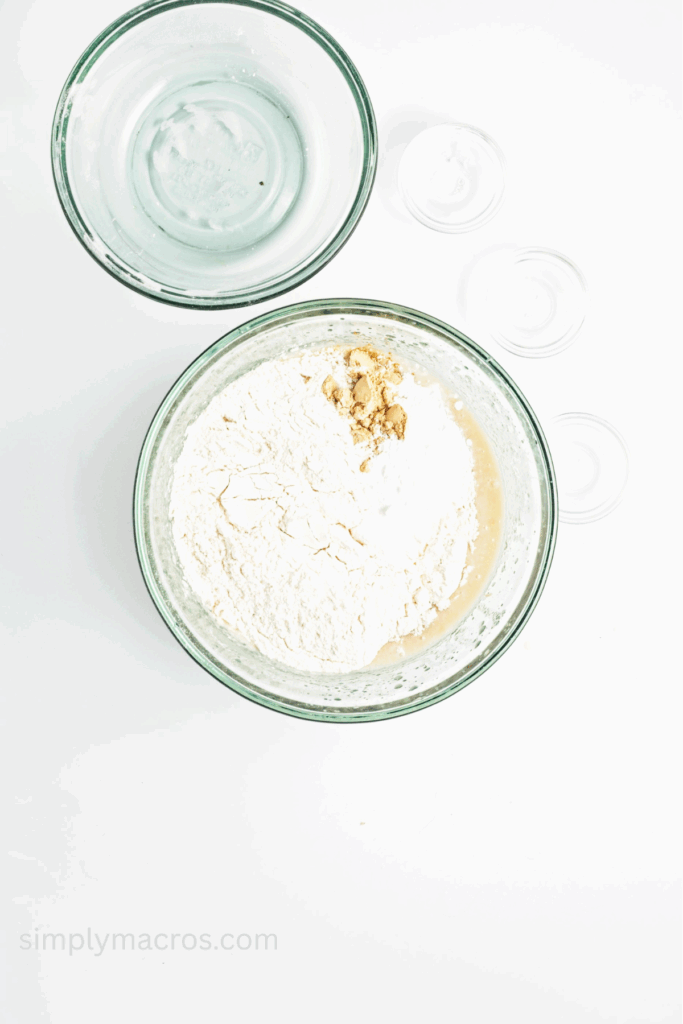 Flour, baking powder, ginger, and salt added to the mixing bowl.